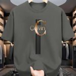 ⁦Men's Casual Calvin Print T-Shirt - Black with Golden Stripe Design, Comfortable Polyester Crew Neck Tee for Everyday Streetwear, Summer Essential⁩ - الصورة ⁦17⁩