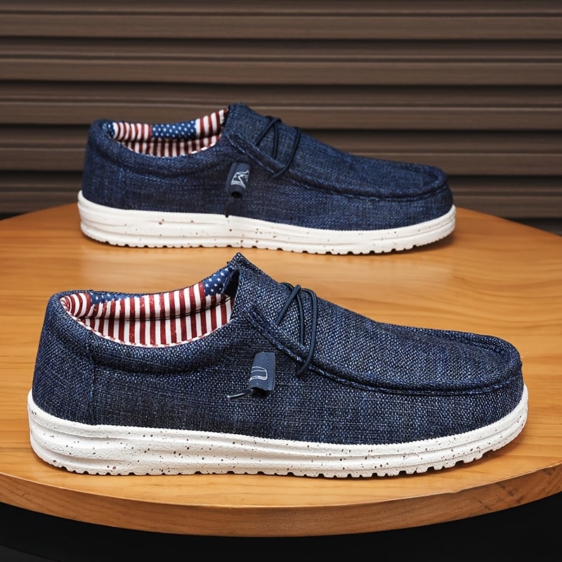 40d7797b-530d-4217-be4c-789136459053.jpg Men's Casual Canvas Loafers with Decorative Shoelaces - Comfortable, Slip-Resistant Slip-On Sneakers for All Seasons | Round Toe Design, Lightweight Canvas Upper, White Sole, American Flag Print Lining | Perfect for Casual Attire - Image 1