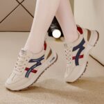⁦Women's Lightweight Running Sneakers - Casual Low-Top Lace-Up Shoes with Soft Non-Slip Rubber Sole, Beige with Blue & Red Stripes, Lightweight & Comfortable for All-Day Wear⁩ - الصورة ⁦2⁩