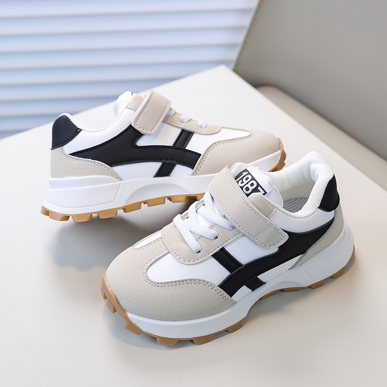 7124cf6a-4c85-4a99-8166-497d3dce6fb8.jpg Stylish Beige & Black Sneakers with Easy Closure Straps, Round Toe, Low Top Design for Running and Daily Wear, Preppy Style, Tpr Sole, Casual Athletic Shoes | Stylish Athletic Shoes | Easy Closure Strap Sneakers - الصورة 1