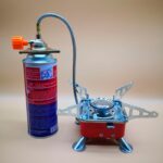 Portable Stainless Steel Camping Gas Stove with Electric Ignition - Windproof, Sturdy Support for Outdoor Hiking And Picnics.