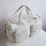 Large Capacity Diaper Bag for Parents - Multi-Compartment Travel Organizer with Zippered Main Compartment, Suitable for Youngsters' Essentials, Polyester Material, White with Cute Bear Emblem