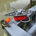 ⁦Portable Stainless Steel Camping Gas Stove with Electric Ignition - Windproof, Sturdy Support for Outdoor Hiking And Picnics.⁩ - الصورة ⁦3⁩
